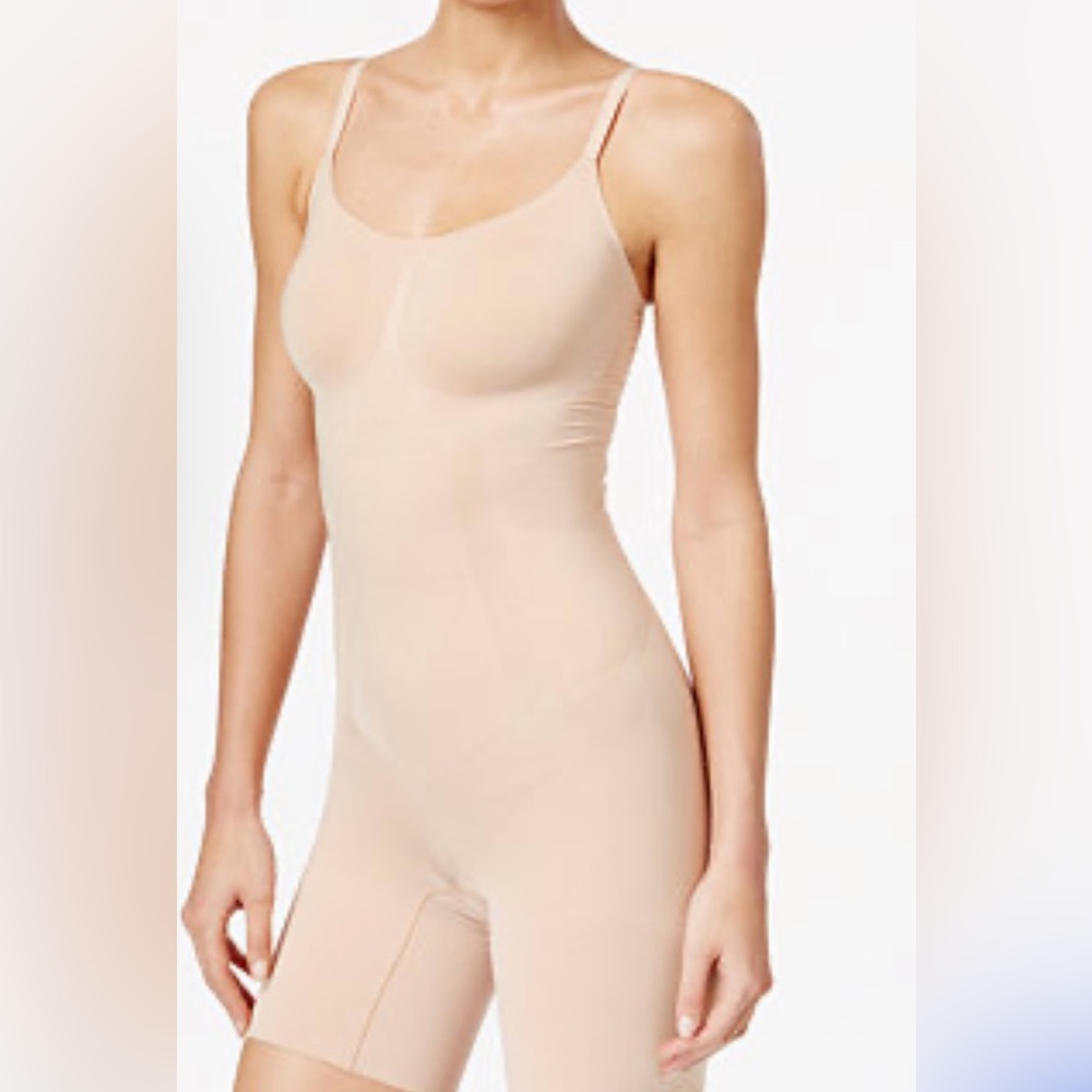 Spanx Oncore mid thigh bodysuit. Never worn.